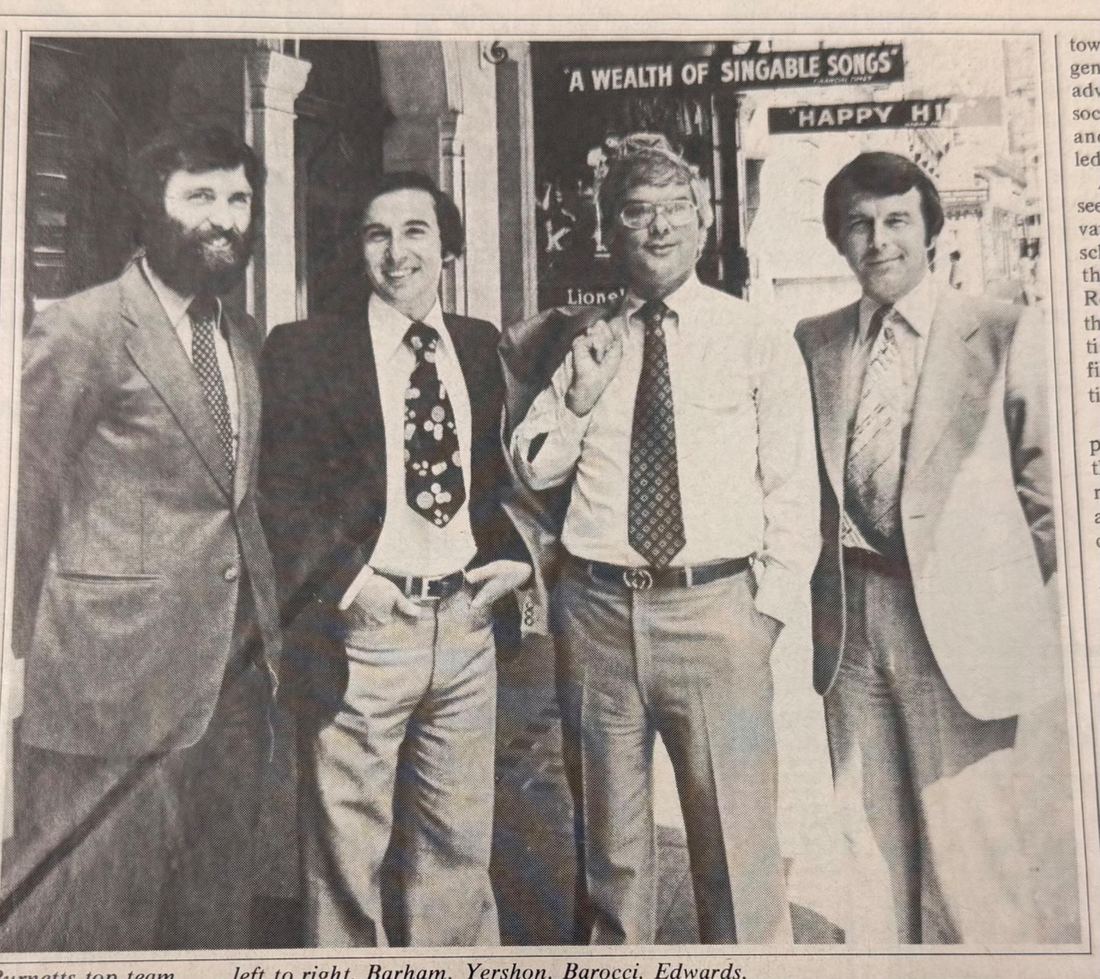 Archive photograph from 1978 of four men in suits, Mike Yershon second from left
